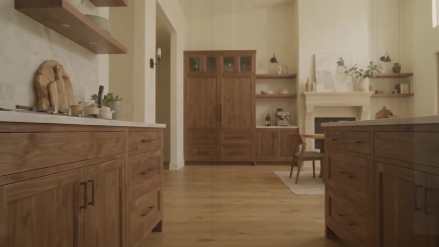 Walnut kitchen with custom cabinetry, island and integrated pantry